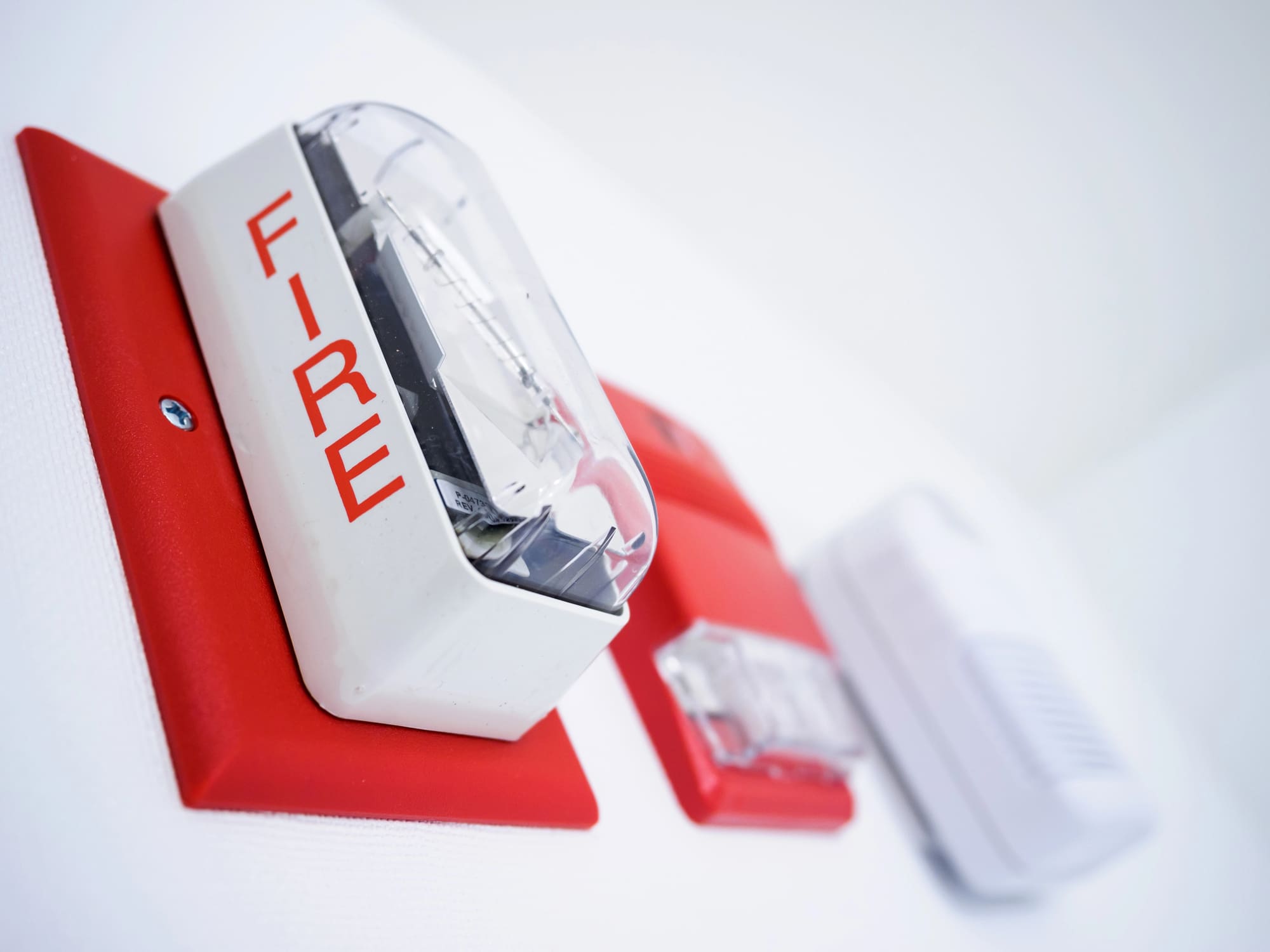 Commercial fire alarm supplier installs flashing fire alarm strobe device