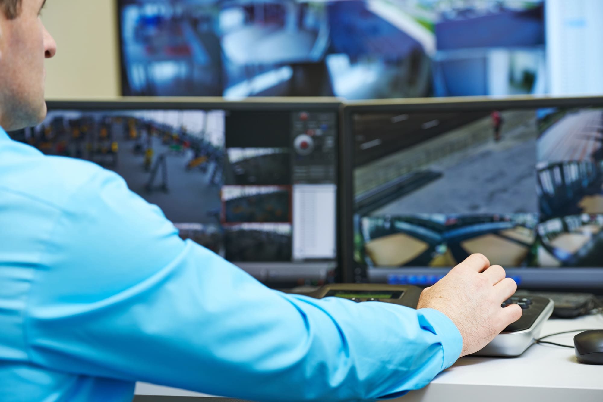commercial fire alarms monitoring Commercial fire alarms monitoring center with security operator at workstation