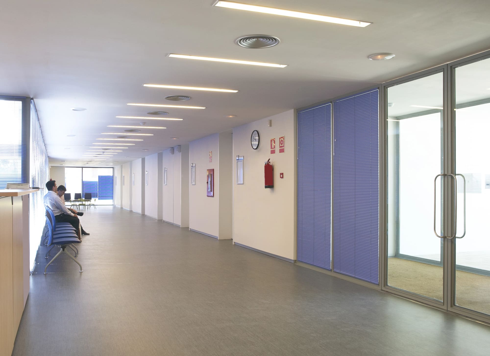 Commercial fire alarm installation Cleveland components visible in modern office hallway ceiling