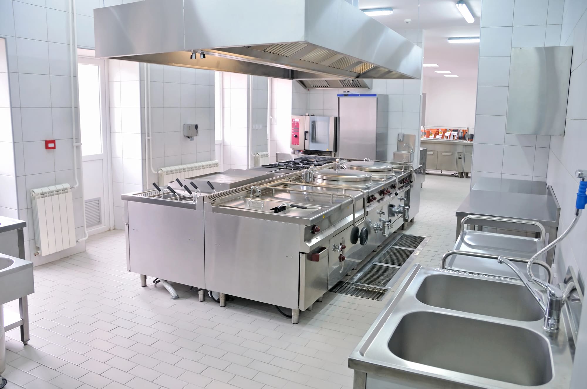Commercial fire alarm installation Cleveland in professional kitchen with stainless equipment